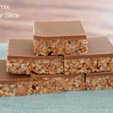 Pieces of slice made with Rice Bubbles and Mars Bars, and topped with a layer of milk chocolate.