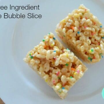 Two pieces of slice made with Rice Bubble's and 100's & 1000's mixed through.