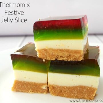 Red and green jelly layers on pieces of a jelly slice.