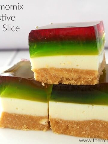 Red and green jelly layers on pieces of a jelly slice.