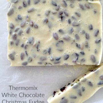 Dried cranberries and pistachios in a slab of white chocolate fudge.