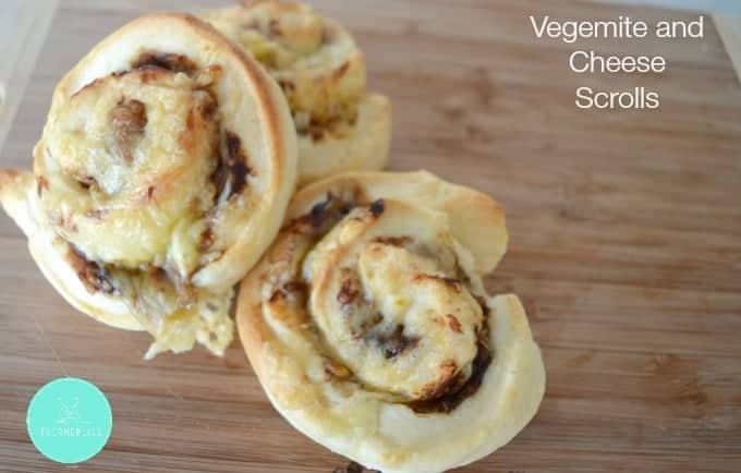 A pile of three baked scrolls with a Vegemite and cheese filling rolled through them.