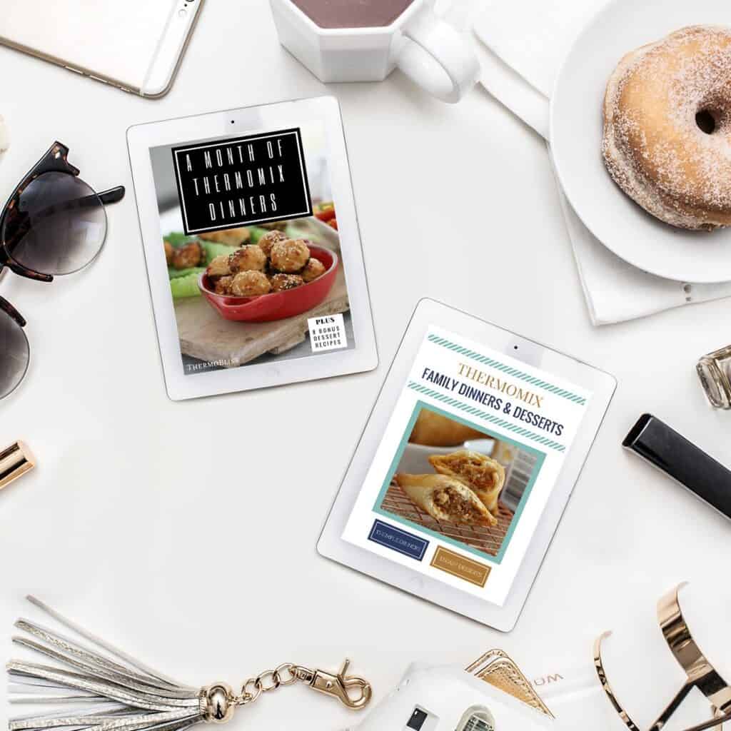 2 ipads displaying Ebooks. A month of Thermomix dinners and Thermomix family dinners and dessert. Ipads surrounded by a doughnut on a plate, A cup of coffee, sunglasses and a tassled key chain. 