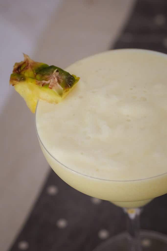 An overhead shot of a glass of pina colada.