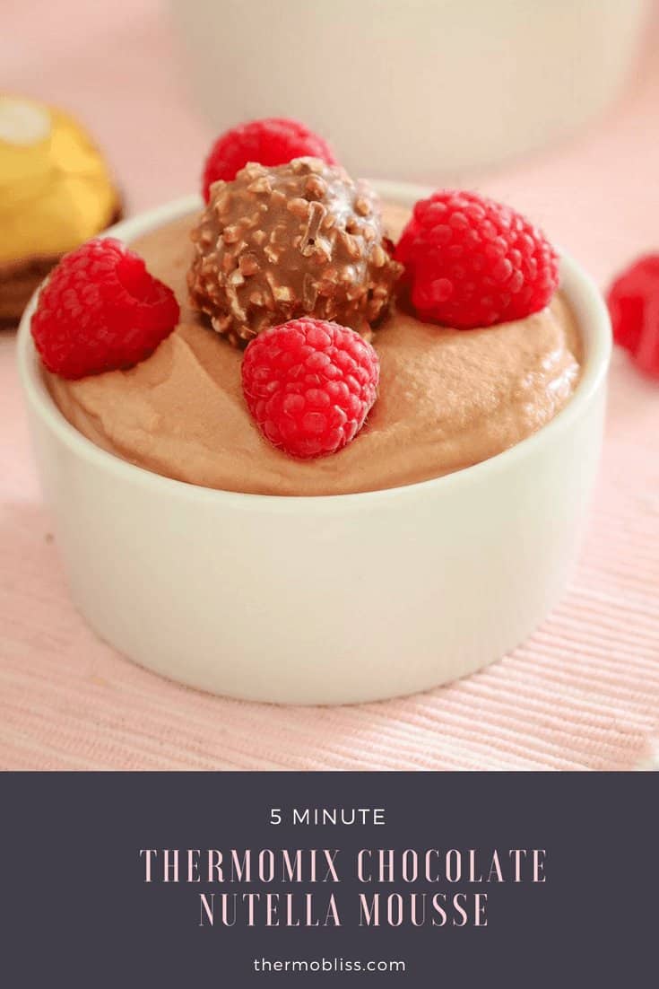 Chocolate and Nutella mousse in a ramekin, with fresh raspberries and a Ferrero Rocher chocolate on top.