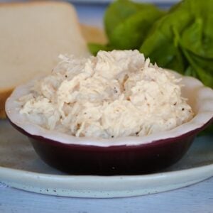 Steamed and shredded white chicken breast meat in a bowl.