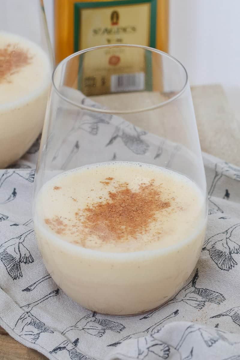 A frothy creamy vanilla drink sprinkled with spices.