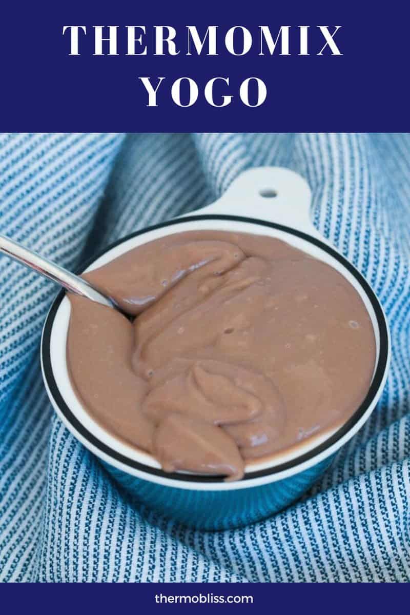 A spoon in chocolate custard. 