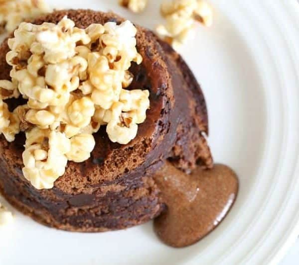 A chocolate lava fondant dessert made in a Thermomix and topped with caramel popcorn.