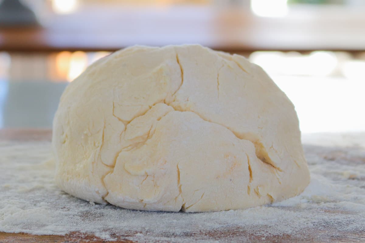 A ball of dough on a floured ball.