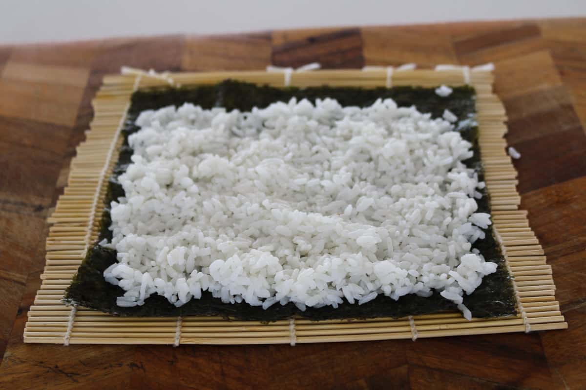 Sushi rice on a nori sheet.