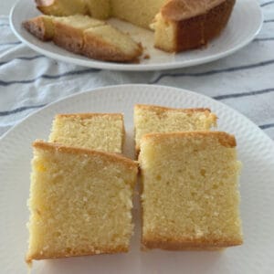 Pieces of a vanilla pound cake cut and served on a white plate