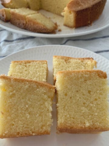 Pieces of a vanilla pound cake cut and served on a white plate