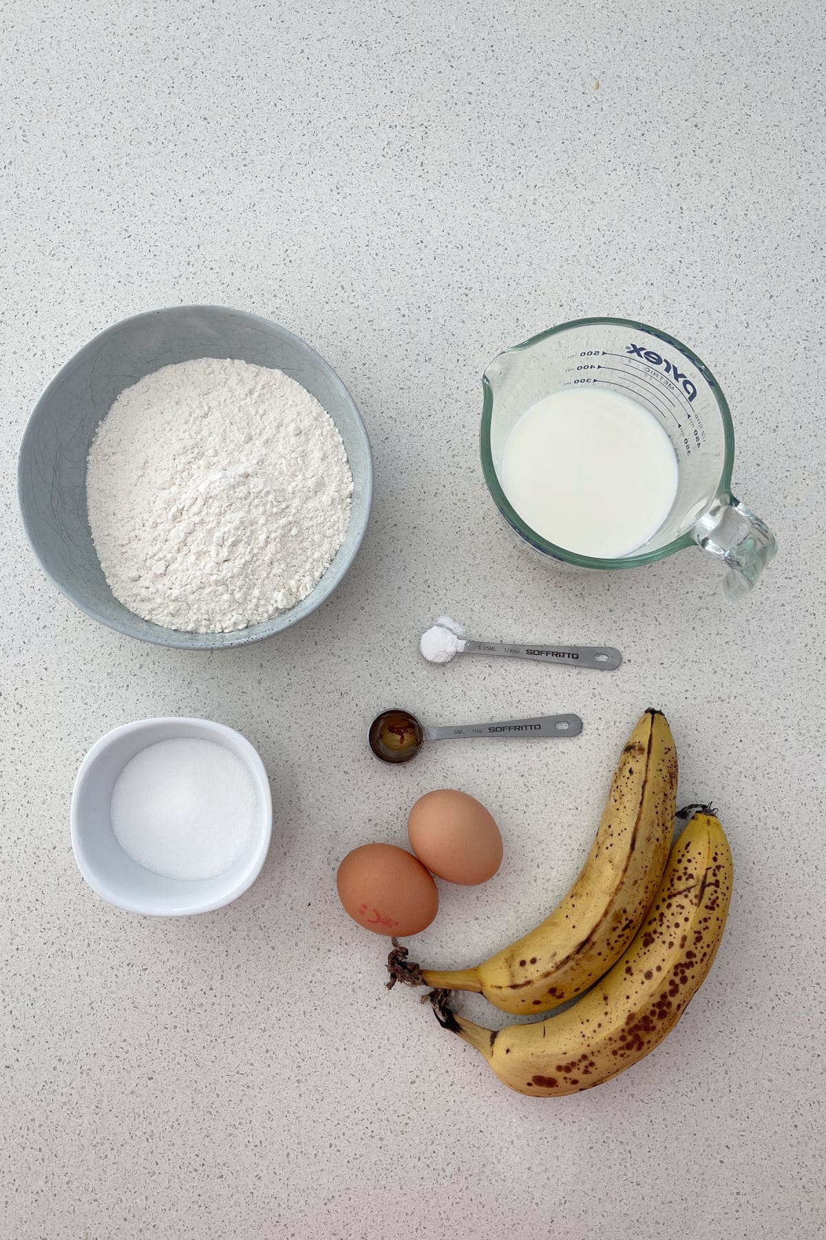 Ingredients to make banana spikelets on a bench top.