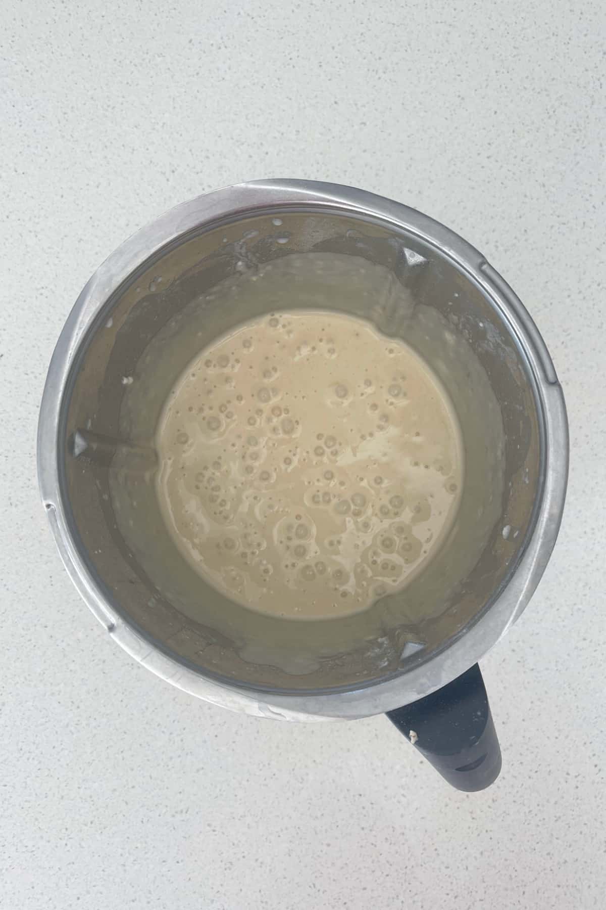 Combined ingredients for banana pikelets in a thermomix bowl.