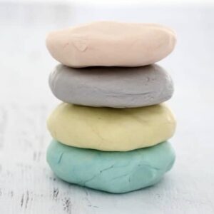 A stack of pastel coloured playdough.
