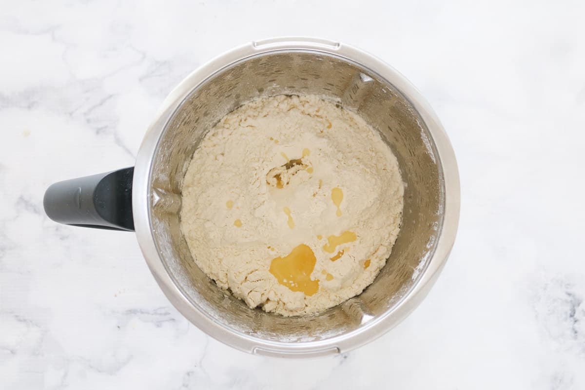 Flour and oil in a Thermomix bowl.