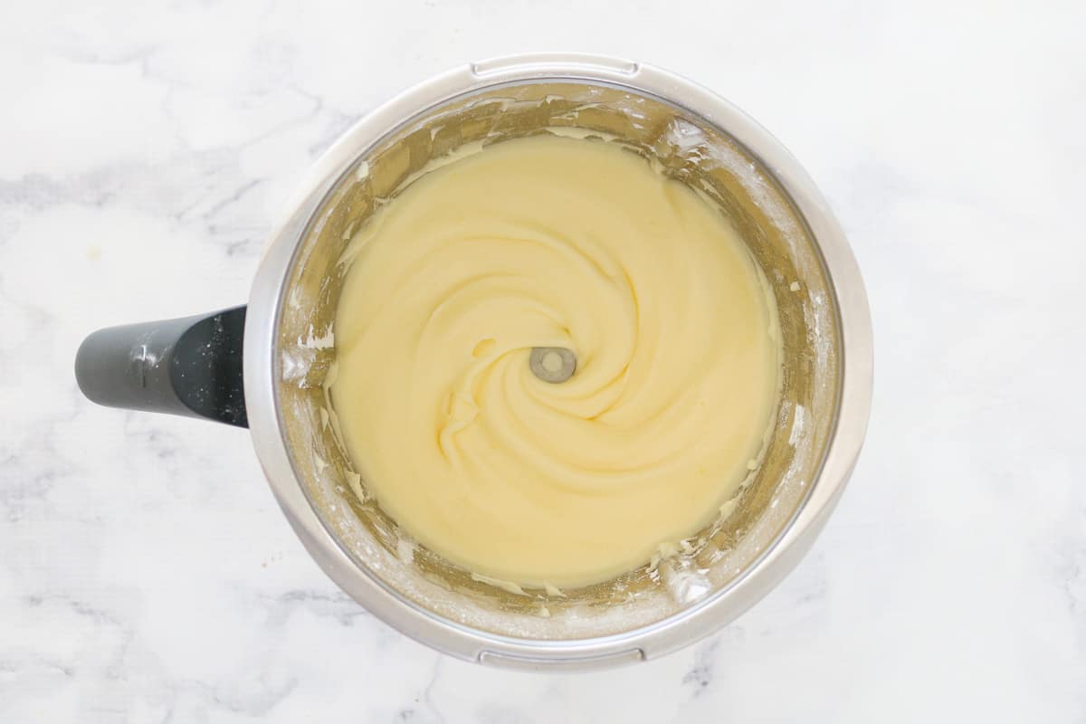 Cream cheese frosting in a Thermomix bowl.