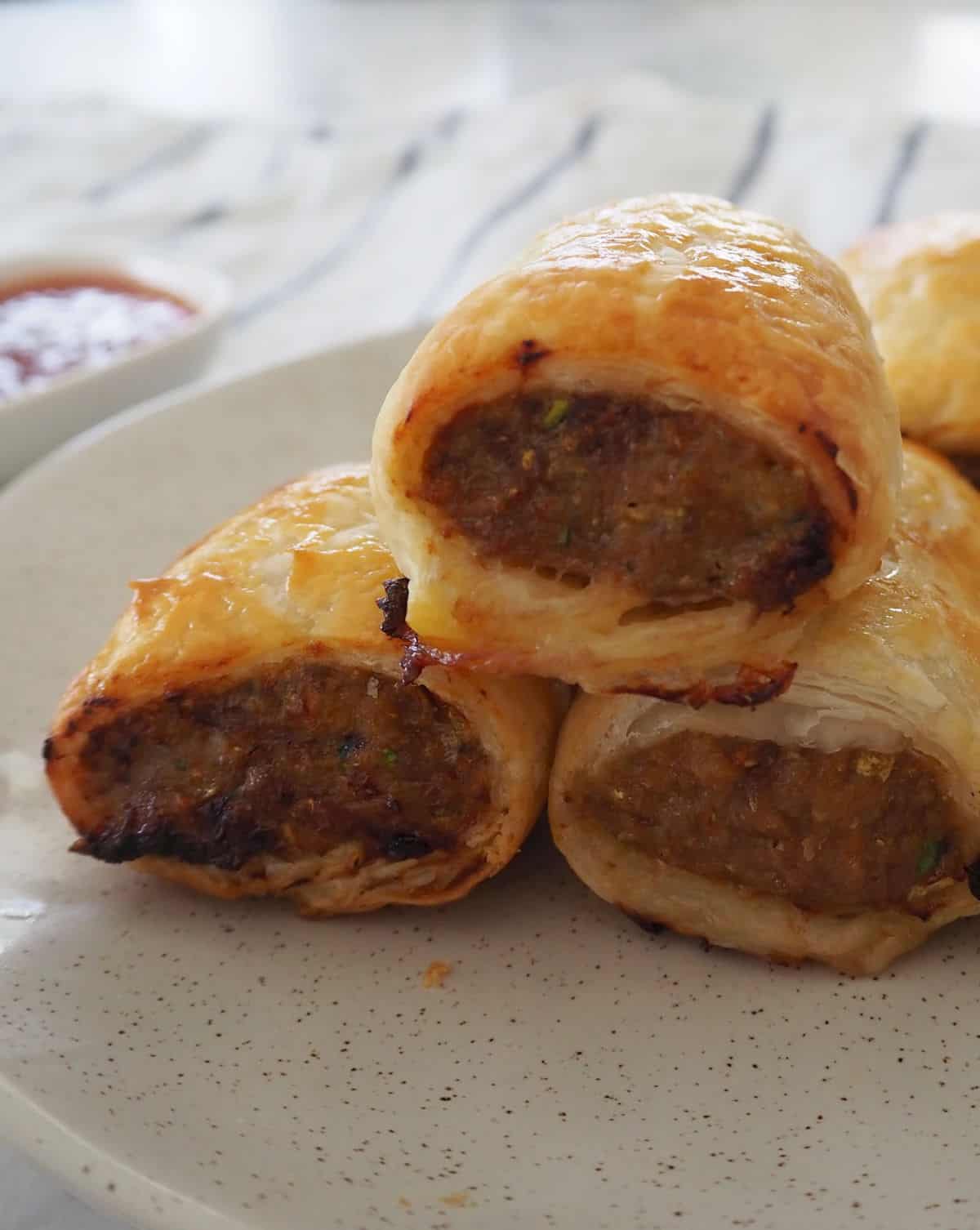 Side view of stack of homemade sausage rolls