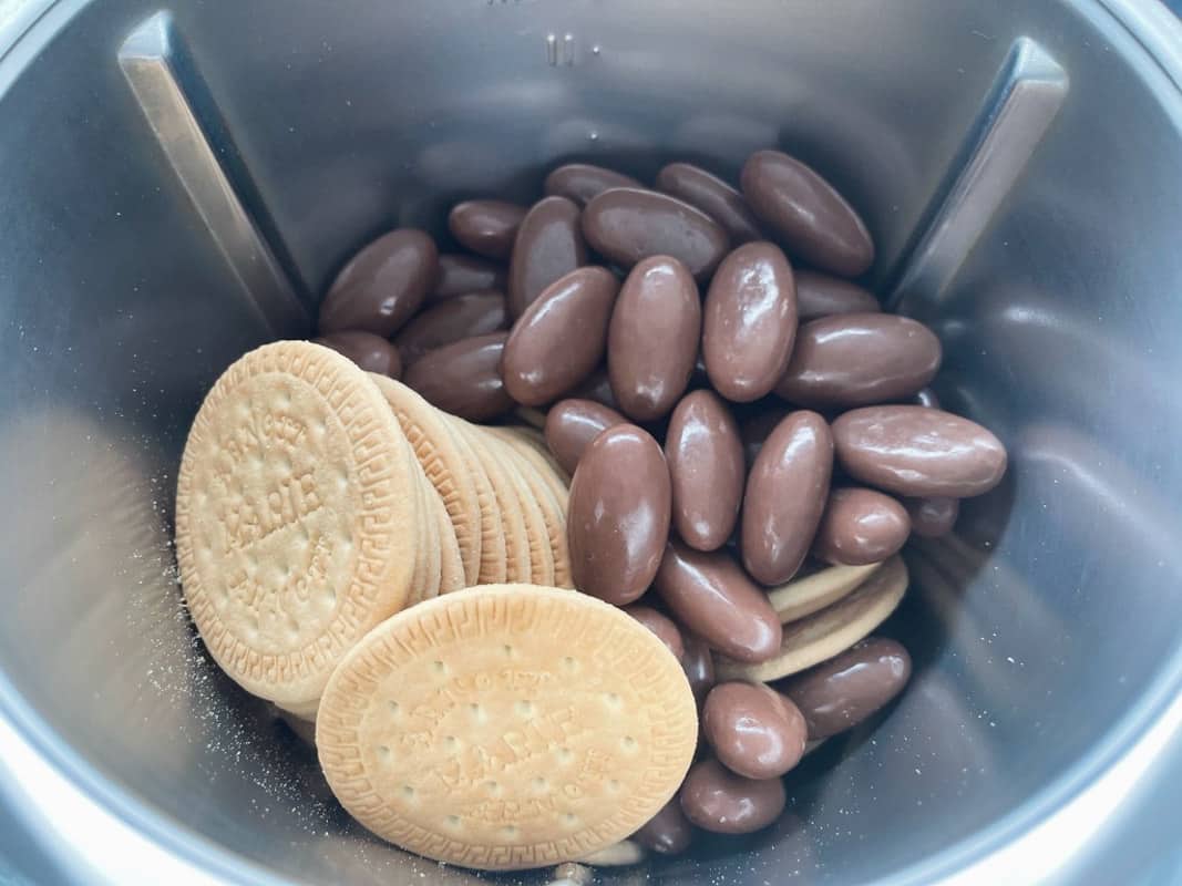 Clinkers and biscuits in a Thermomix bowl.