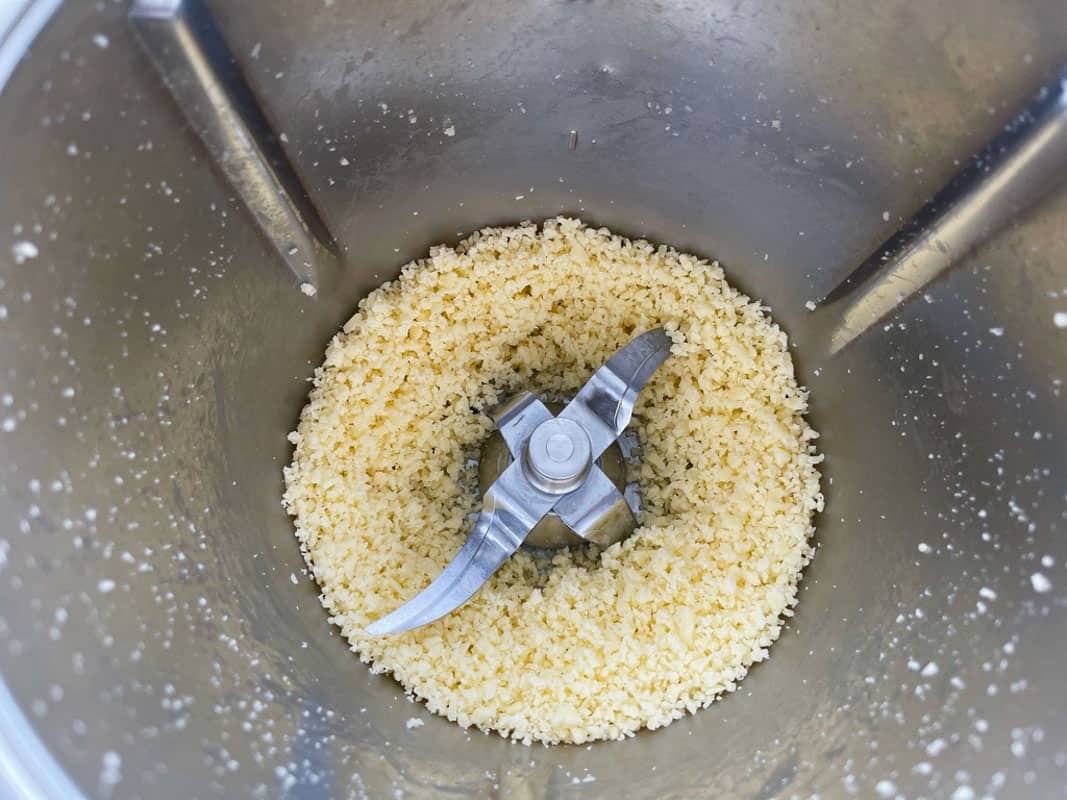 Grated cheese in a Thermomix bowl.