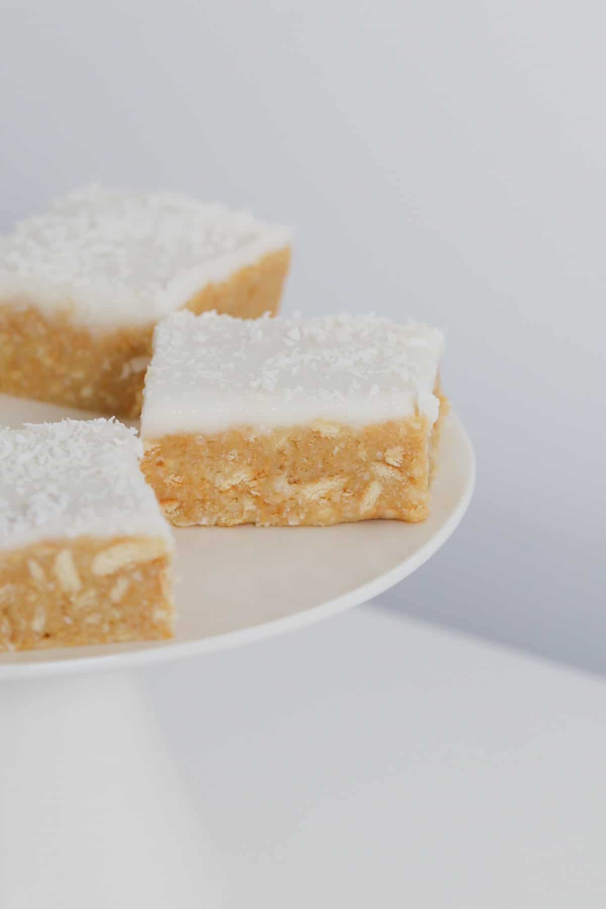 Pieces of biscuit slice with lemon and coconut.