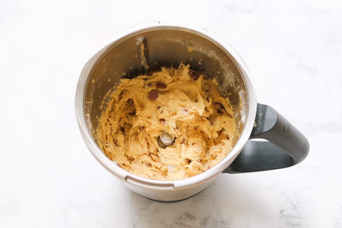 Cookie mixture in a Thermomix bowl.