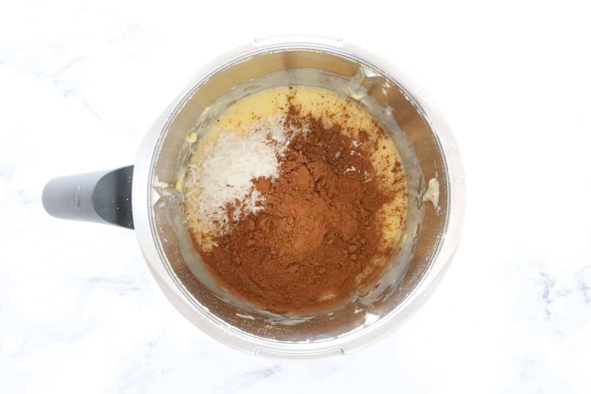 Cocoa, coconut and sweetened condensed milk in a Thermomix.
