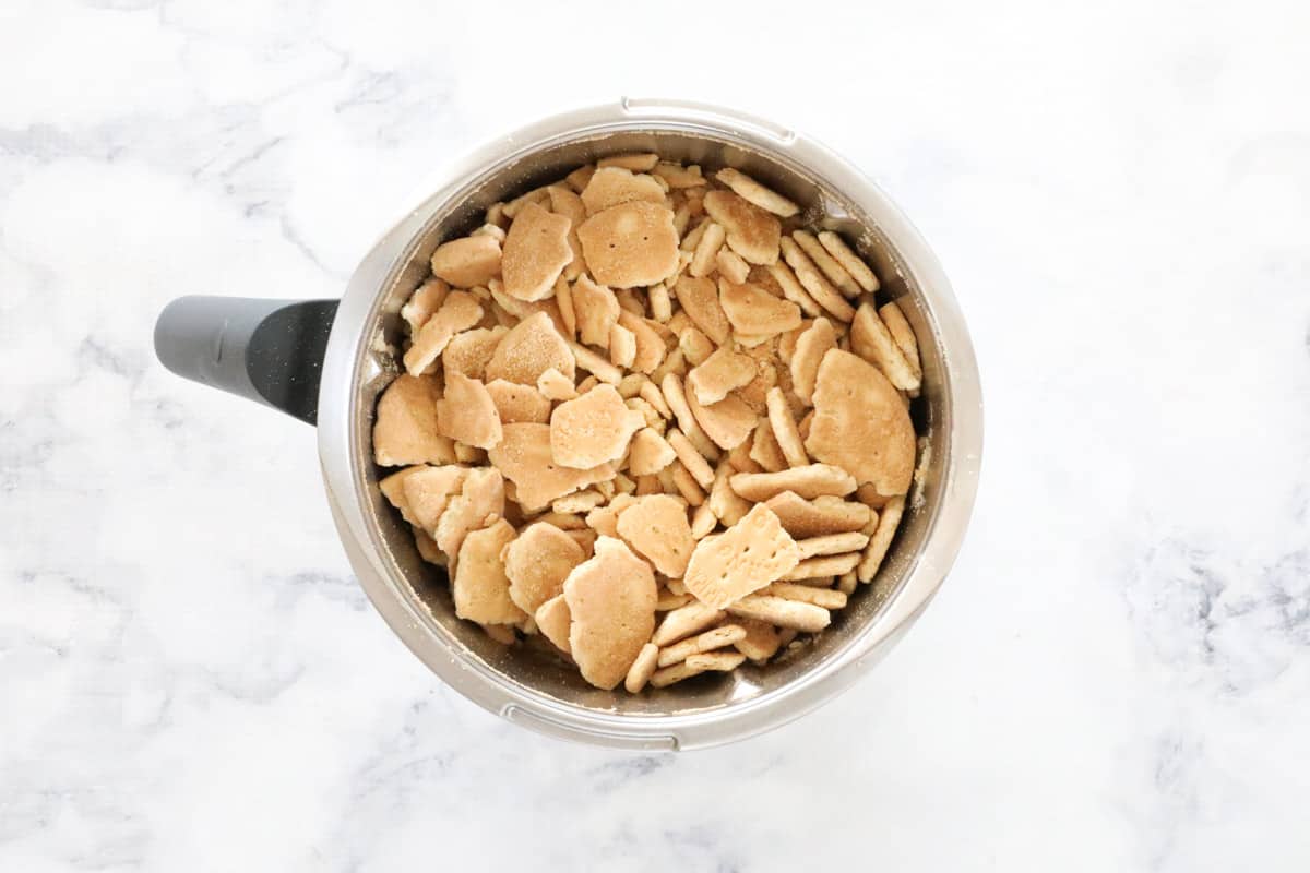 Crushed biscuits in a Thermomix bowl.