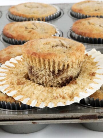 A banana muffin with chocolate chips.