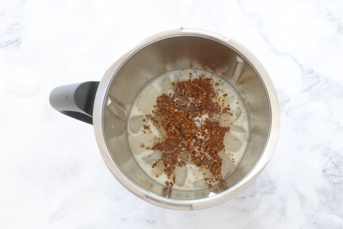 Iced coffee ingredients in a Thermomix bowl.