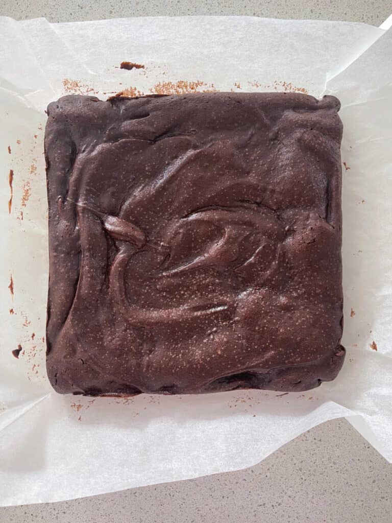 Thermomix Chocolate Brownies from the oven sitting on baking paper.