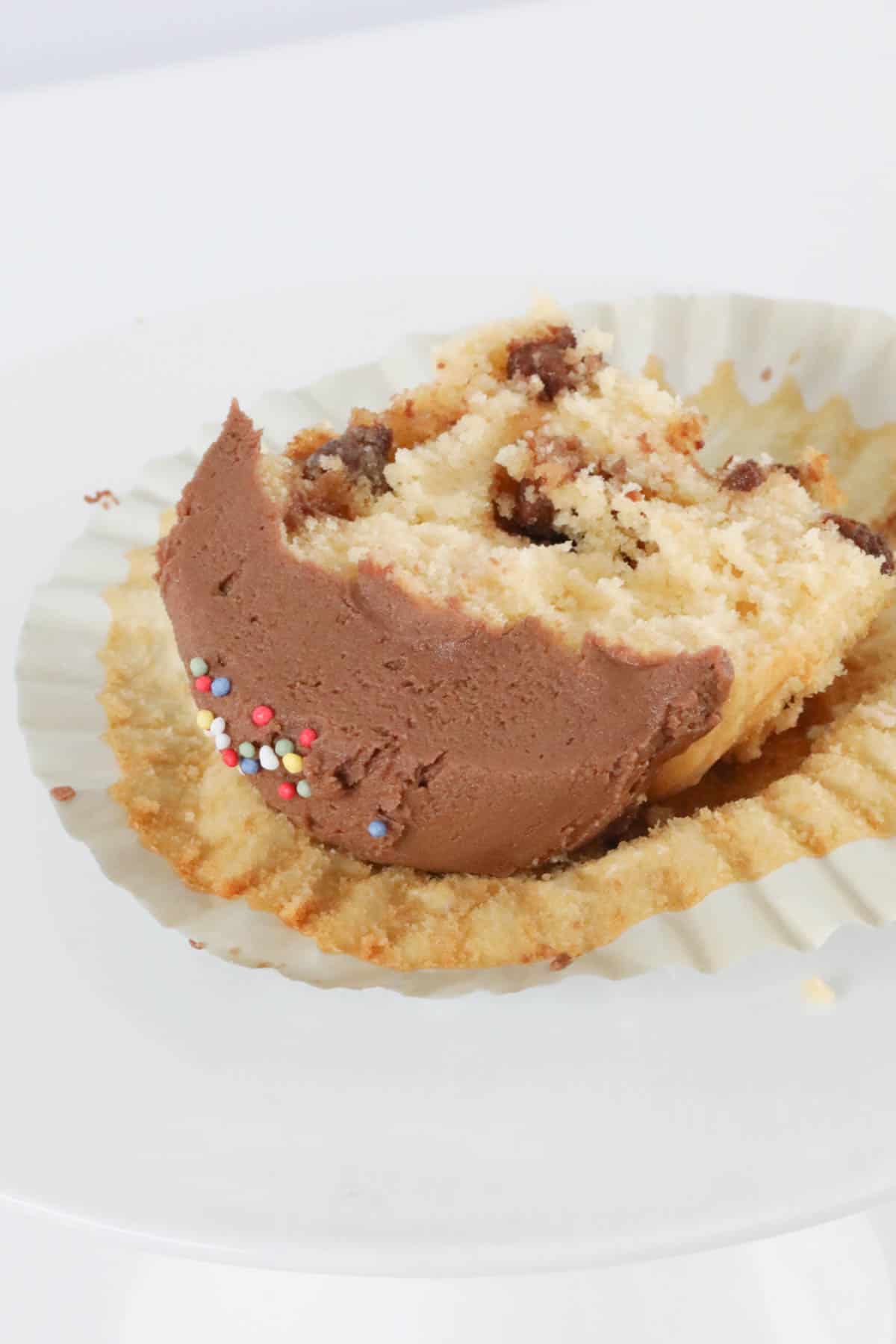 A chocolate chip cupcake with chocolate butterceam.