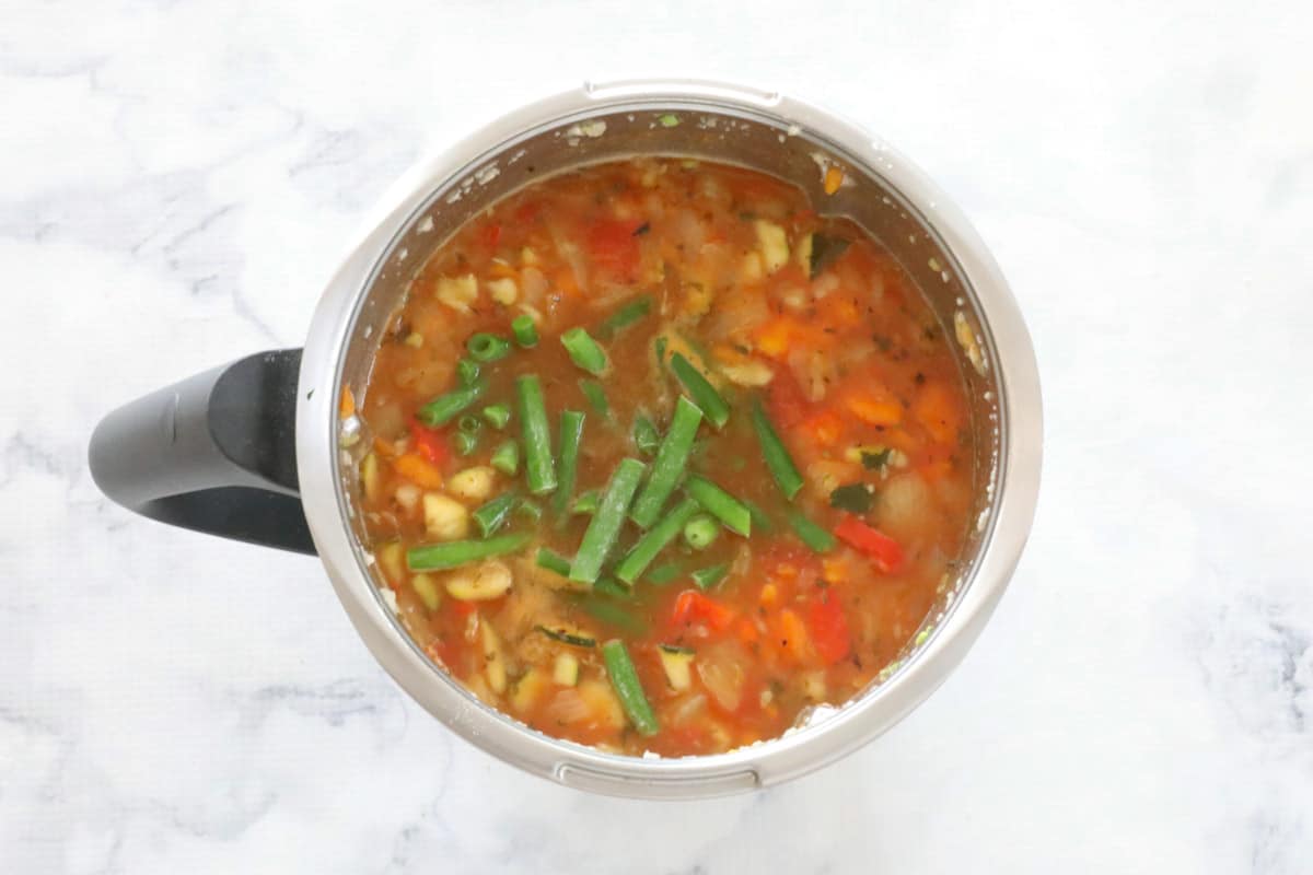 Vegetables and beans in a Thermomix.