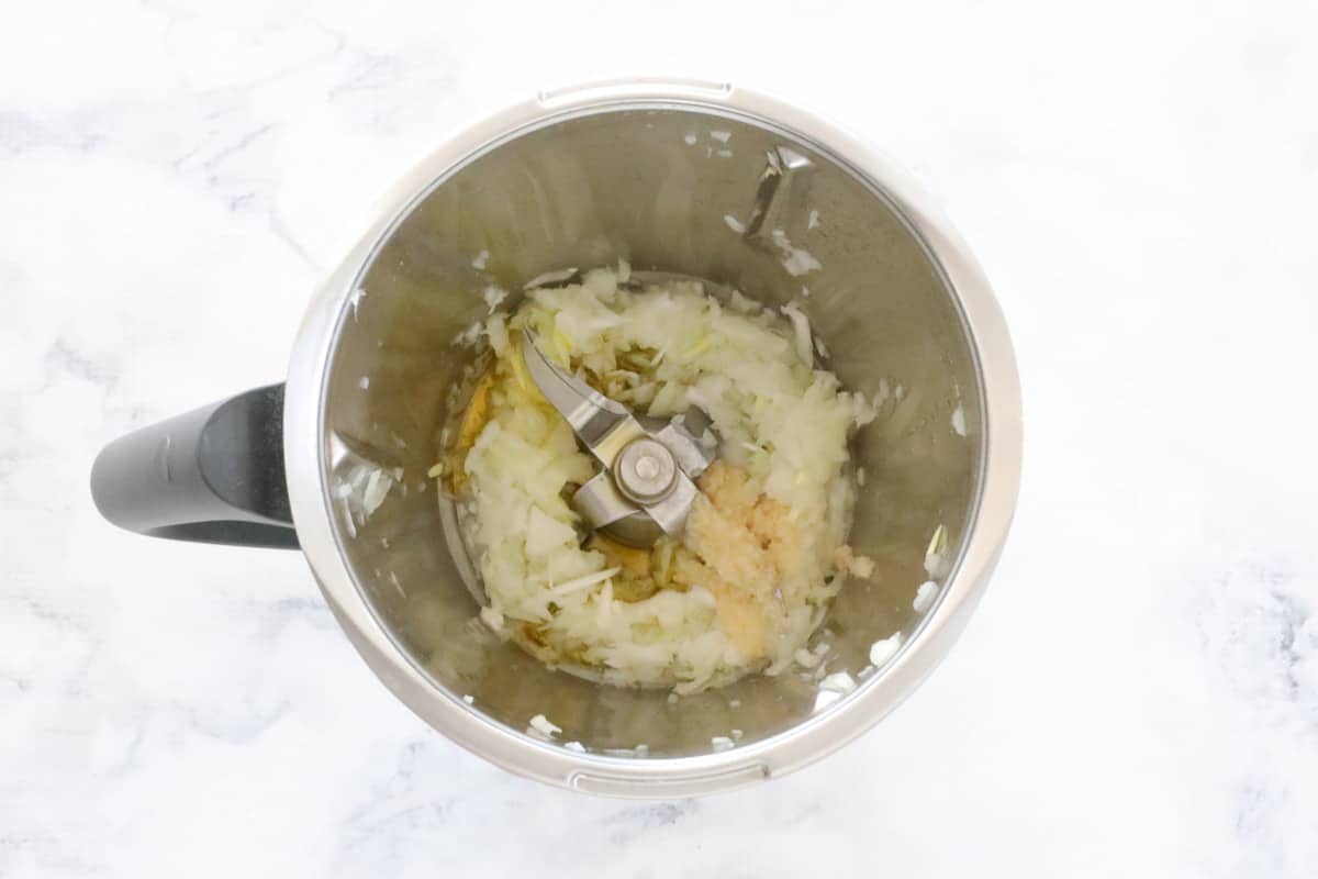 Sauteed onion in a Thermomix bowl.