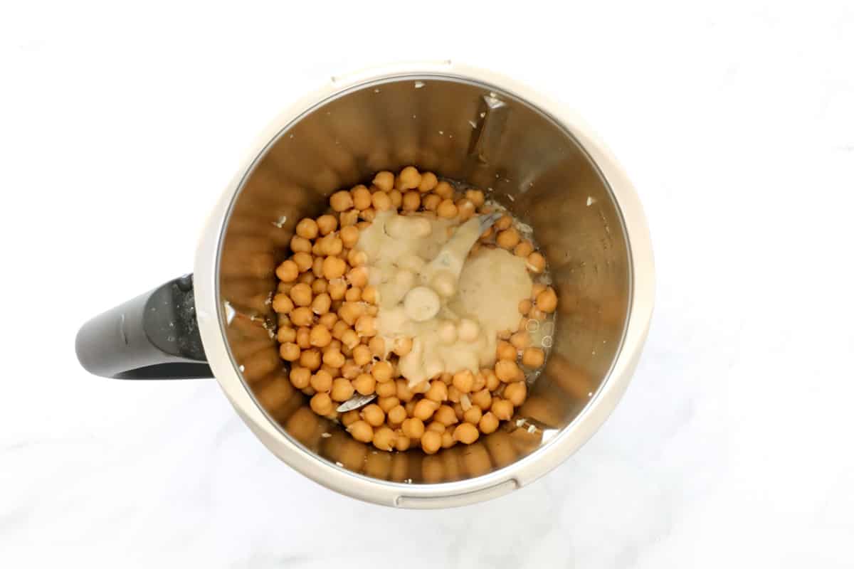 Chickpeas and tahini in a jug.