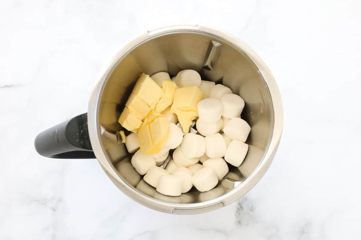 Marshmallows and butter in a stainless jug.