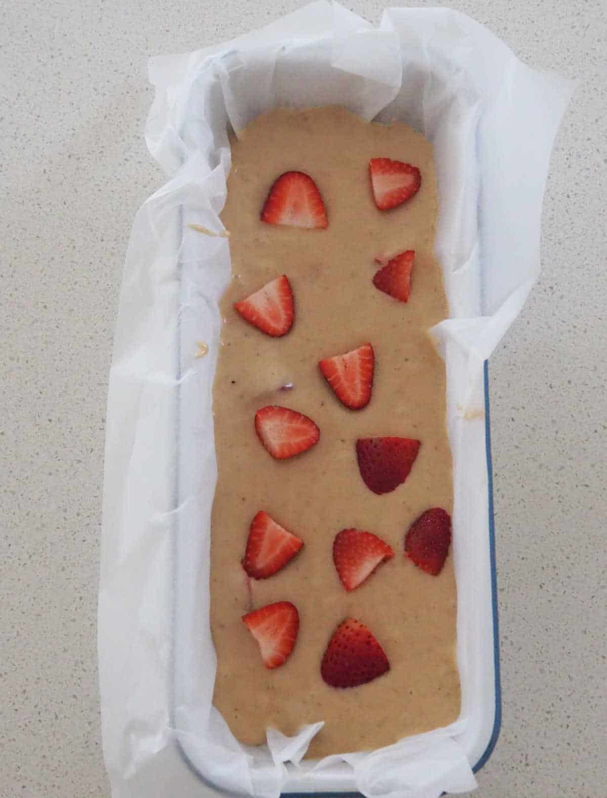 Banana and Strawberry Loaf in baking tin.