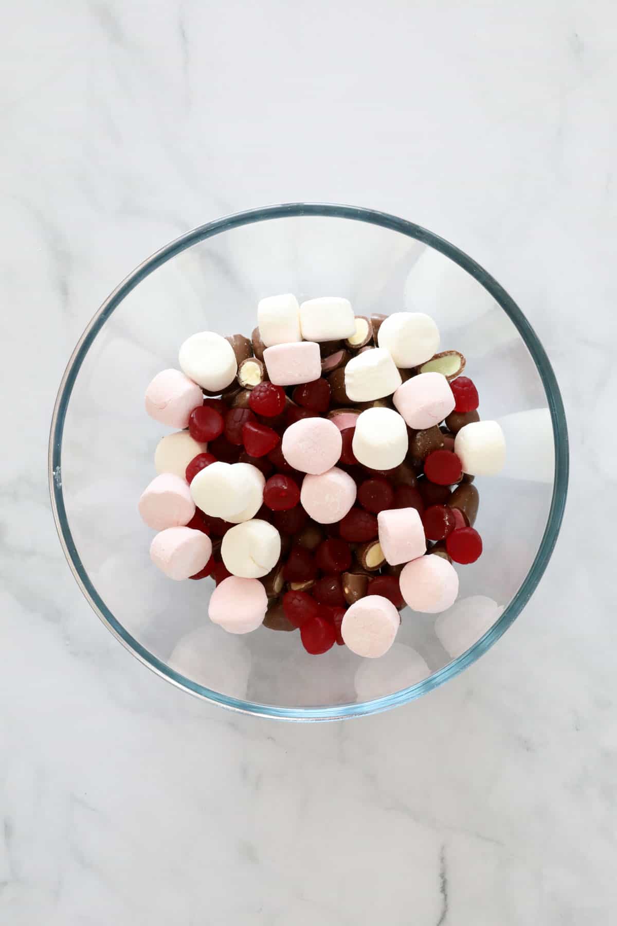 Marshmallows, Clinkers and raspberry lollies in a bowl.