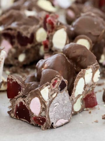 Chunks of rocky road on a chopping board.