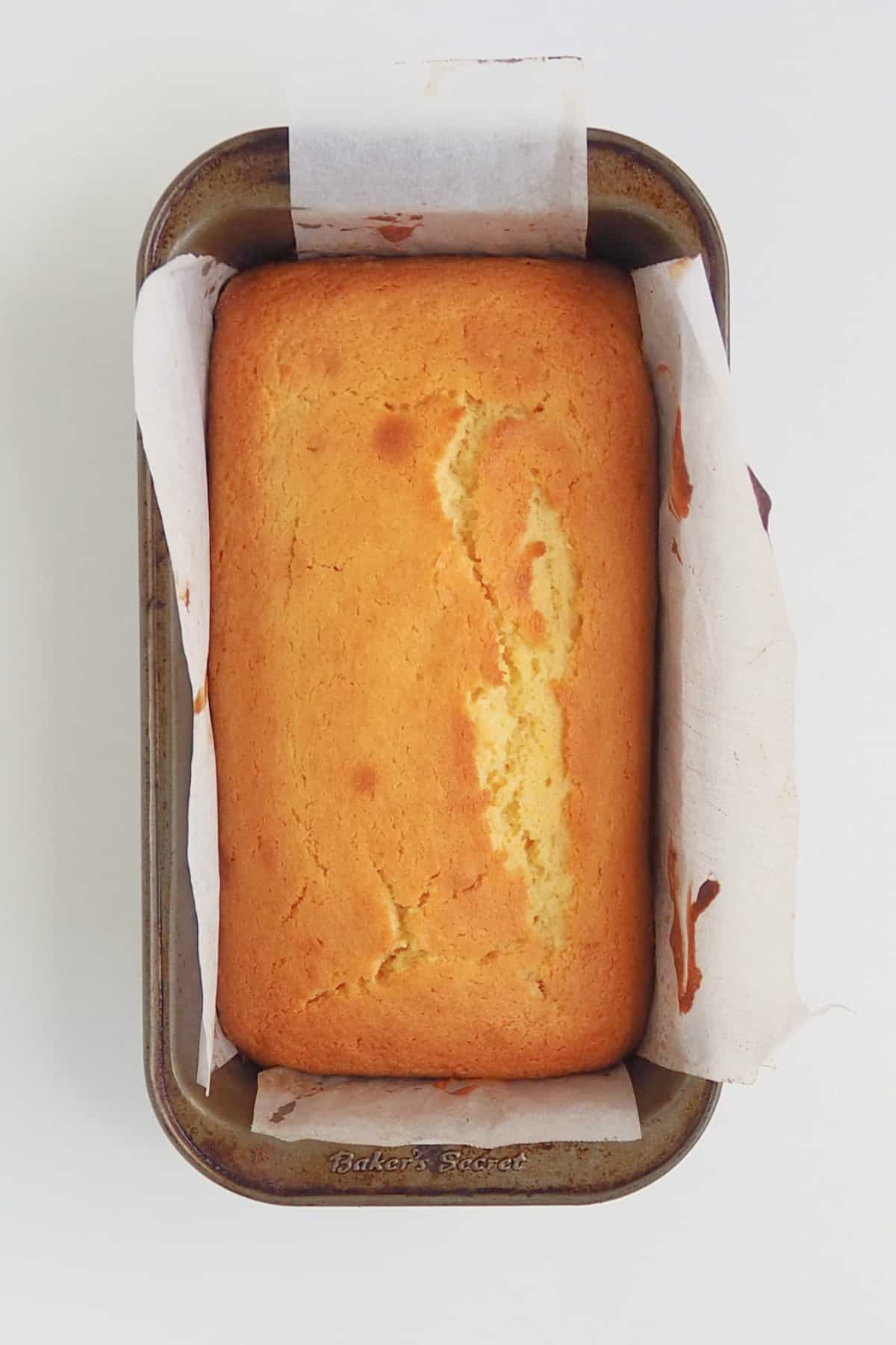 Baked orange butter cake in a loaf tin.