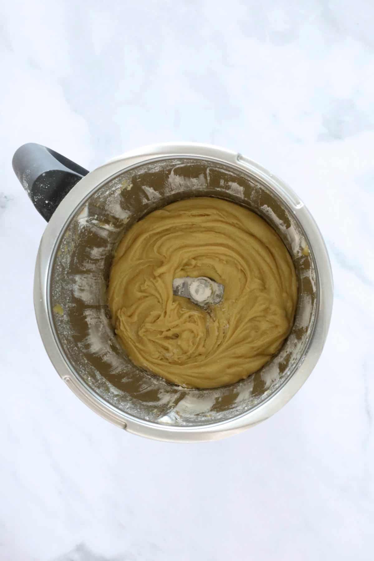 Cookie dough mixture in a Thermomix bowl.