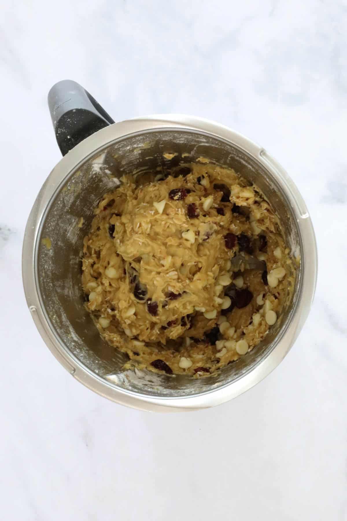 Cookie dough in a Thermomix bowl.