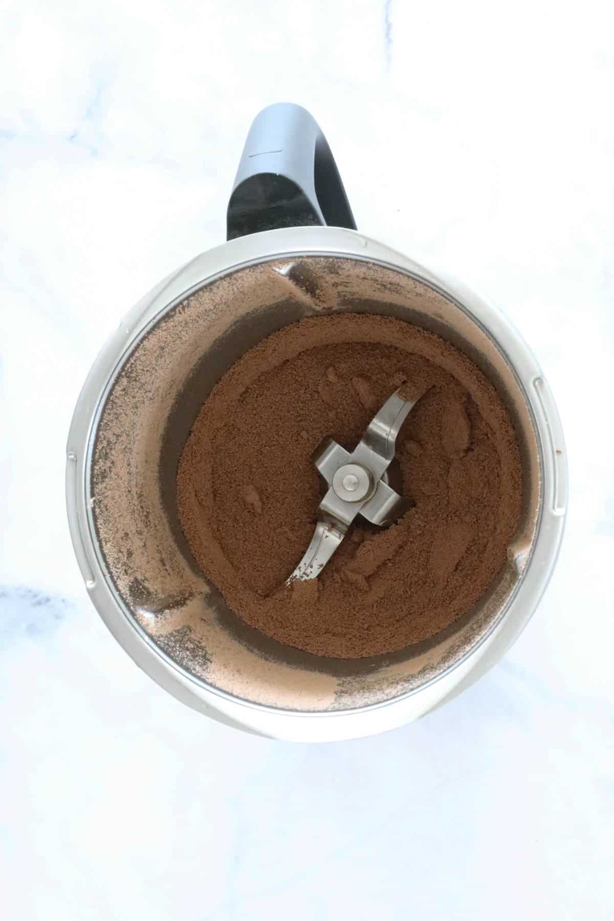 An overhead shot of a jug with grated chocolate.
