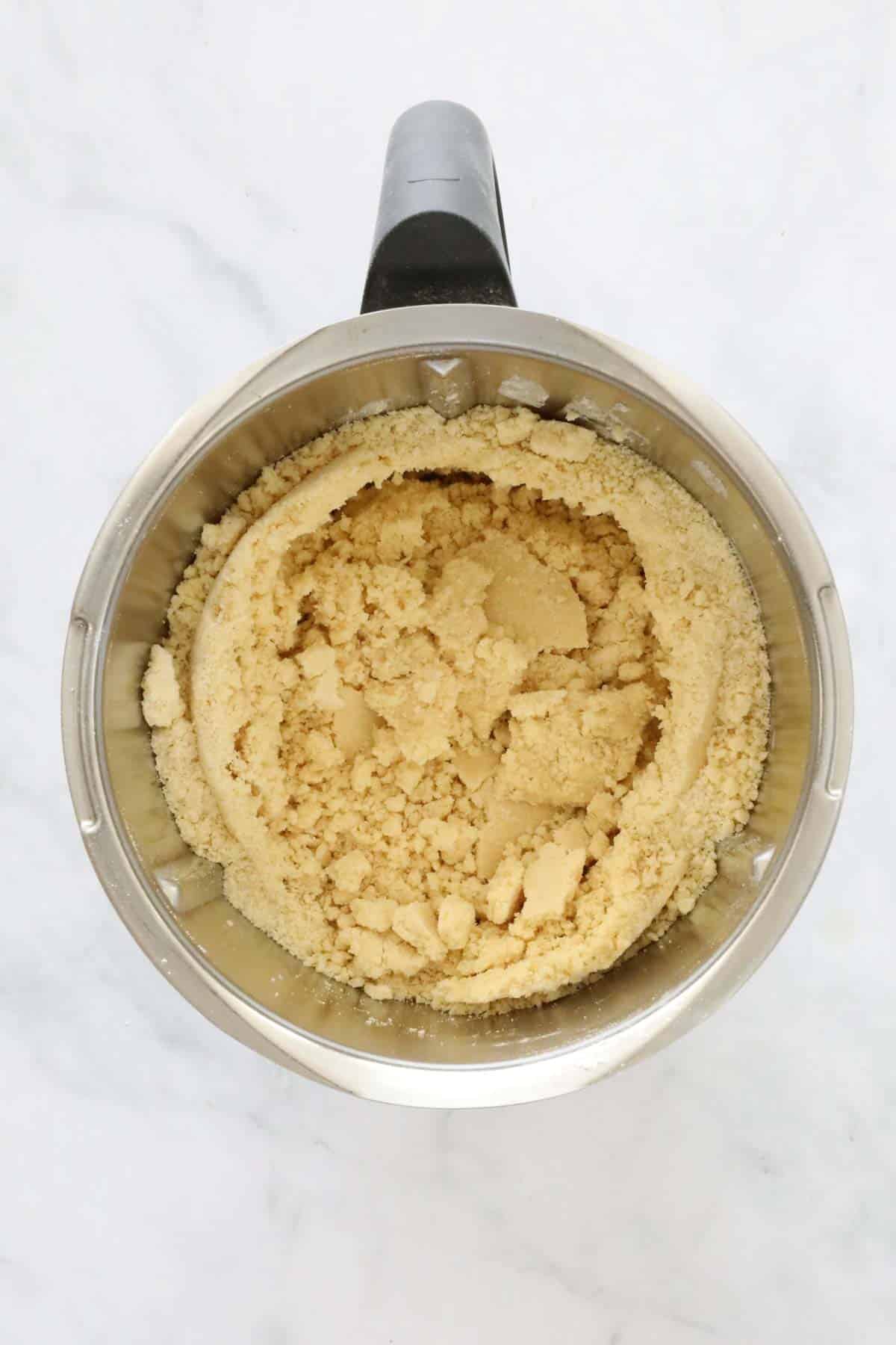Shortbread crumbs in a Thermomix bowl.
