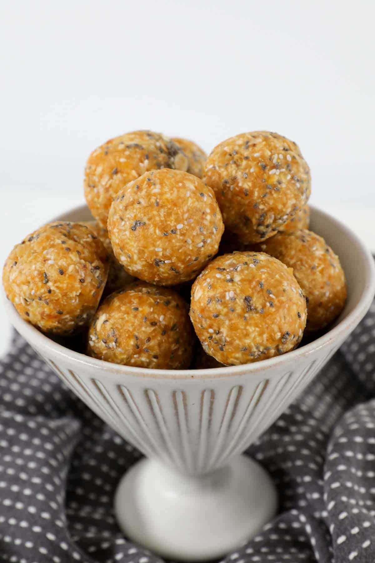 A bowl filled with apricot balls.