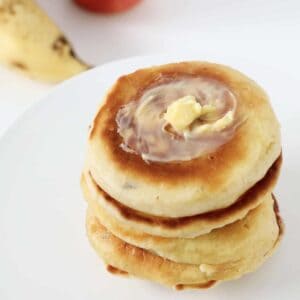 Butter on top of pikelets.