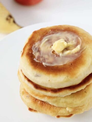 Butter on top of pikelets.