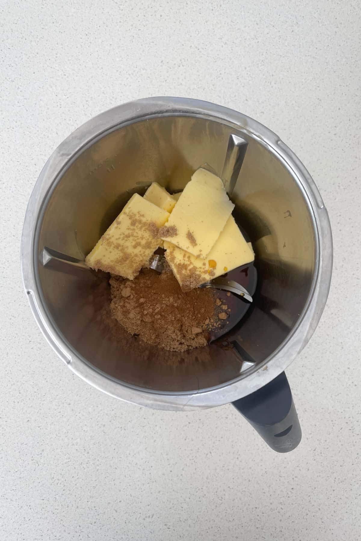 Ingredients to make gingerbread in a thermomix bowl.