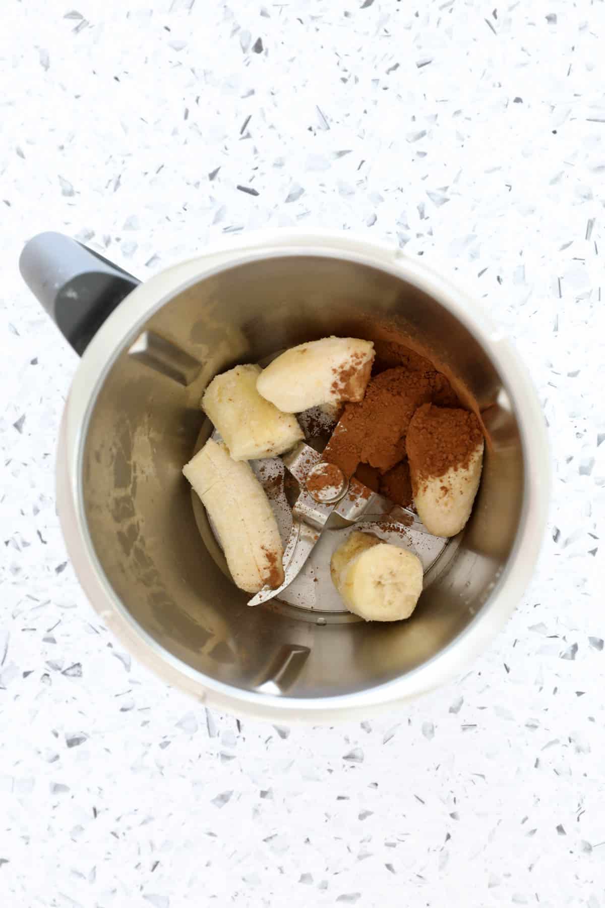 Frozen bananas and cocoa powder in a Thermomix.